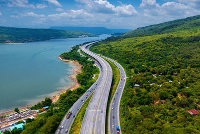 High angle view of road by mountain against sky