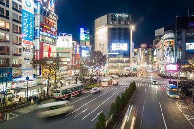 Light trails on road in city at night