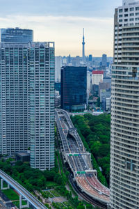 High angle view of buildings in city against sky