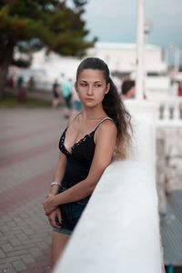 Portrait of woman sitting outdoors