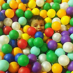 Portrait of cute boy playing with balloons