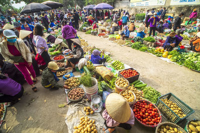 Group of people for sale at market stall