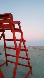 Close-up of red beach against clear sky