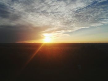 Silhouette of landscape against sky at sunset