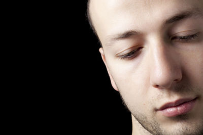 Close-up portrait of a serious young man