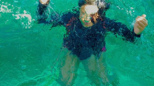 People swimming in sea