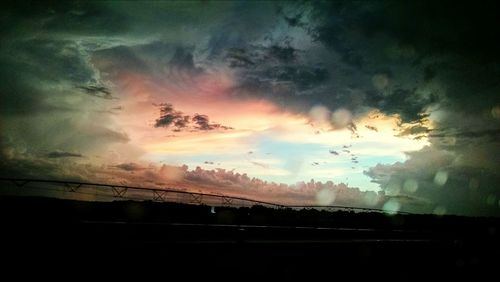 Cloudy sky above sea at sunset