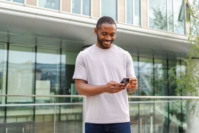 Young man using mobile phone