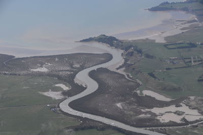 Aerial view of river amidst landscape against sky