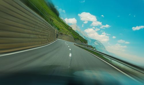 Road seen through car windshield