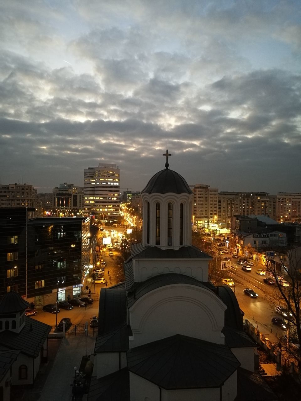 ILLUMINATED CITYSCAPE AT NIGHT