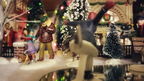 Close-up of statue hanging on christmas tree