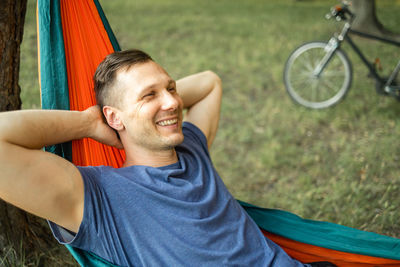 Low section of man exercising on field