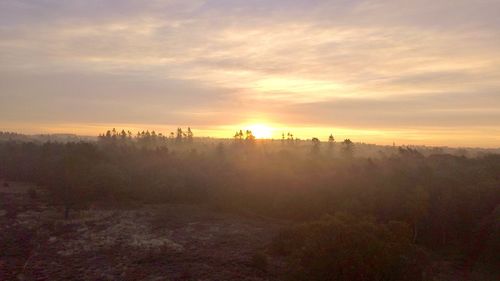 Scenic view of landscape against sky during sunset