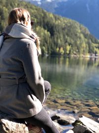 Rear view of woman looking at lake