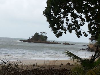 View of calm beach against sky