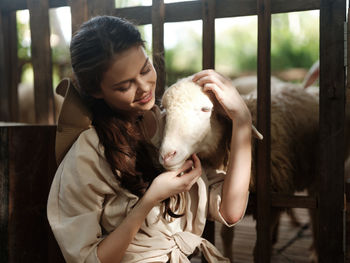 Young woman with goat