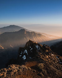 Scenic view of mountains against sky during sunset