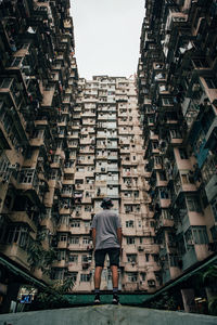 Low angle view of buildings against sky in city