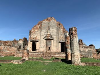 Old ruin building against blue sky