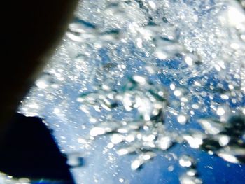 Close-up of snow on water