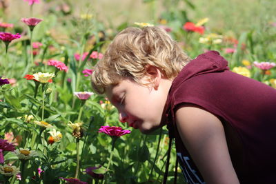 Young woman picking flowers