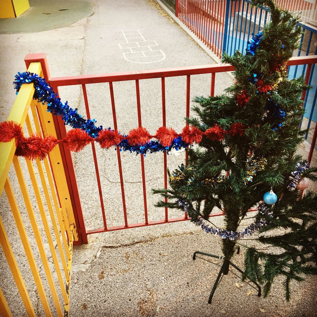 multi colored, railing, hanging, no people, outdoors, day, tree, close-up, architecture