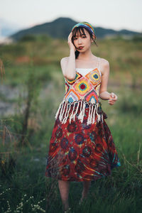 Young woman standing on field