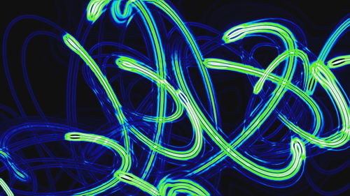 Close-up of light painting against black background