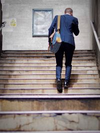 Full length rear view of woman walking outdoors