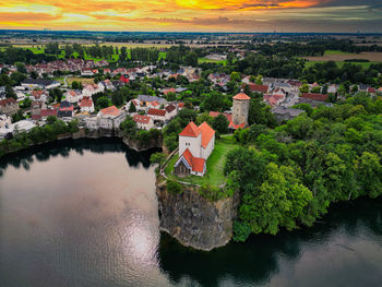 High angle view of townscape by lake