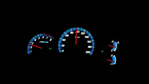 Low angle view of illuminated lighting equipment against black background