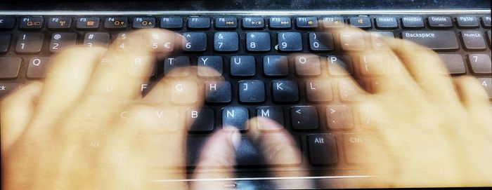 Close-up of hands working at home