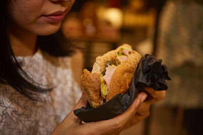 Close-up of woman having food