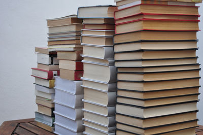 Stacked books on table