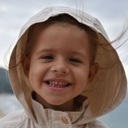 Portrait of smiling girl wearing hood