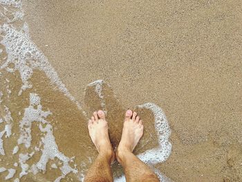 Low section of person on beach