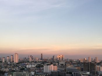 High angle view of buildings against sky during sunset