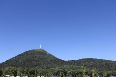 Scenic view of mountains against clear blue sky