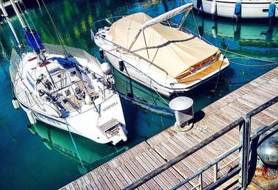 High angle view of boats moored at harbor