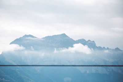 Scenic view of mountains against sky during winter