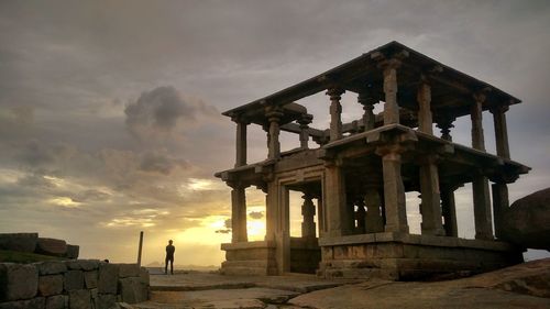 Low angle view of old temple against sky during sunset