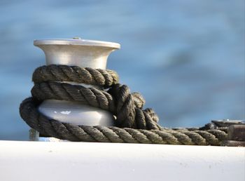 Close-up of rope tied up on metal/boat