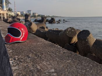 Close-up of stones on beach against sky