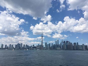 City skyline against cloudy sky