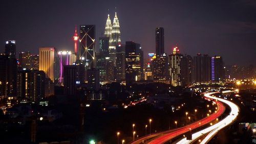 Aerial view of city lit up at night