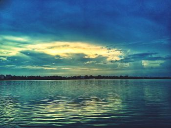 Scenic view of lake against sky during sunset