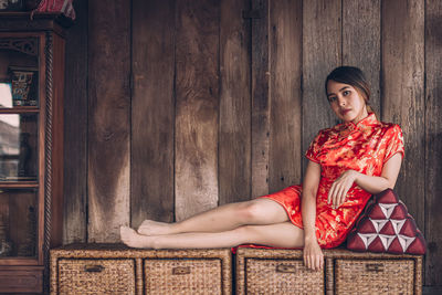 Portrait of young woman sitting outdoors