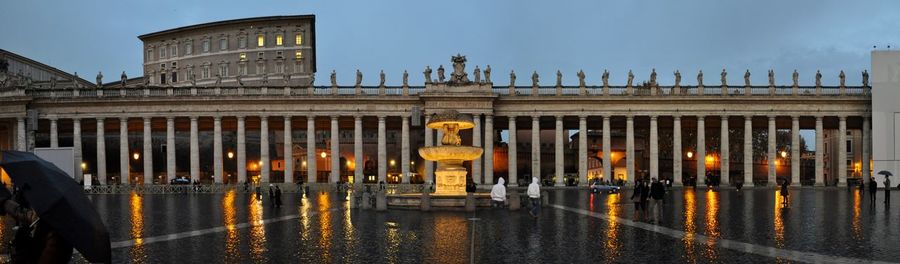 Panoramic view of bernini colonnade against cloudy sky