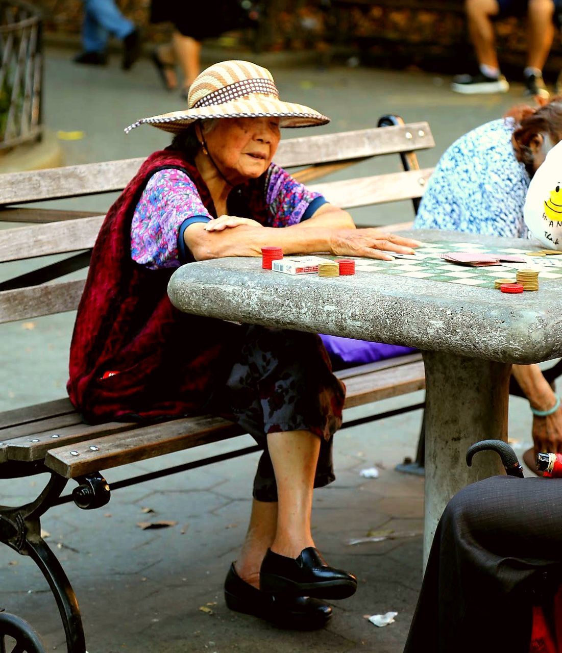 WOMAN SITTING IN HAT